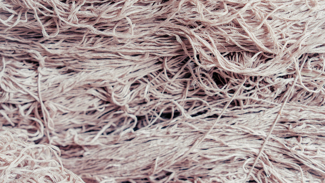 raw silk fibers, spun before the carpet is knotted